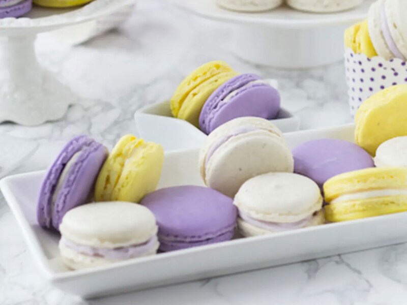 Lavender honey macarons on a serving tray. Lavender honey macarons on a serving tray.