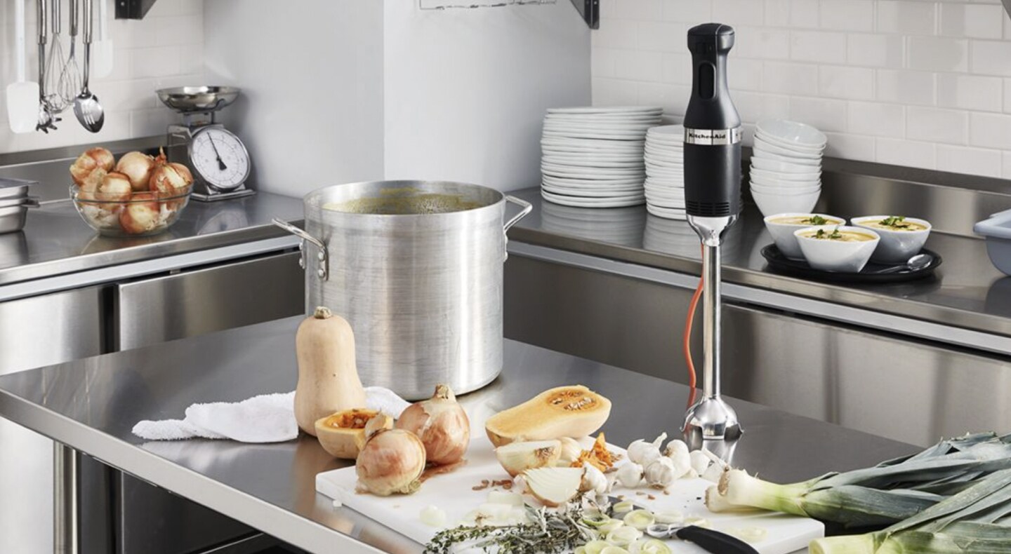 Commercial immersion blender on metal countertop Commercial immersion blender on metal countertop