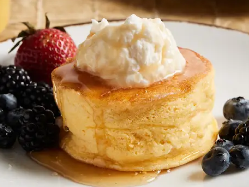Single-serve souffle on plate with fruit Single-serve souffle on plate with fruit