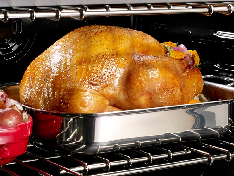 A roast chicken inside an oven