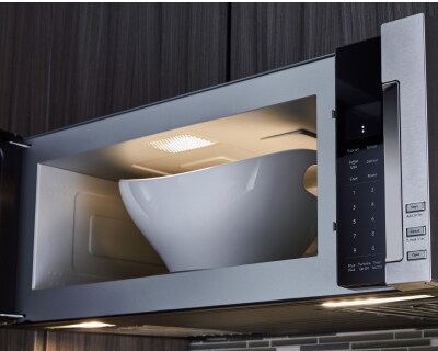 Open microwave with large bowl inside
