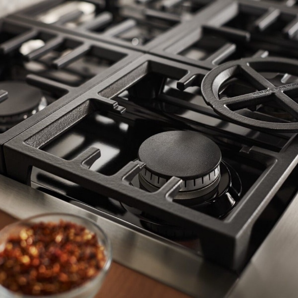 Circular center piece removed from black grate