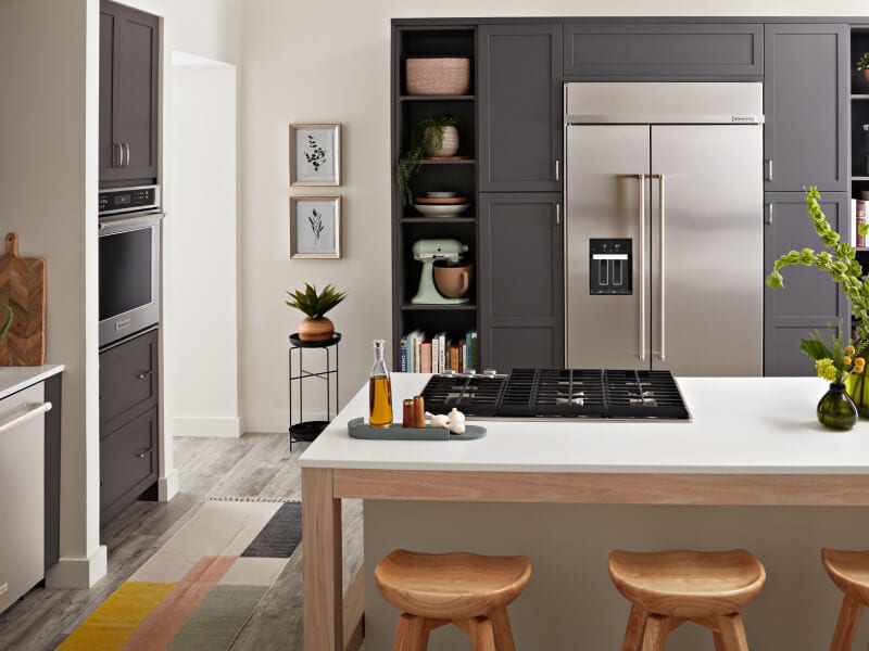 Kitchen island in front of built-in refrigerator