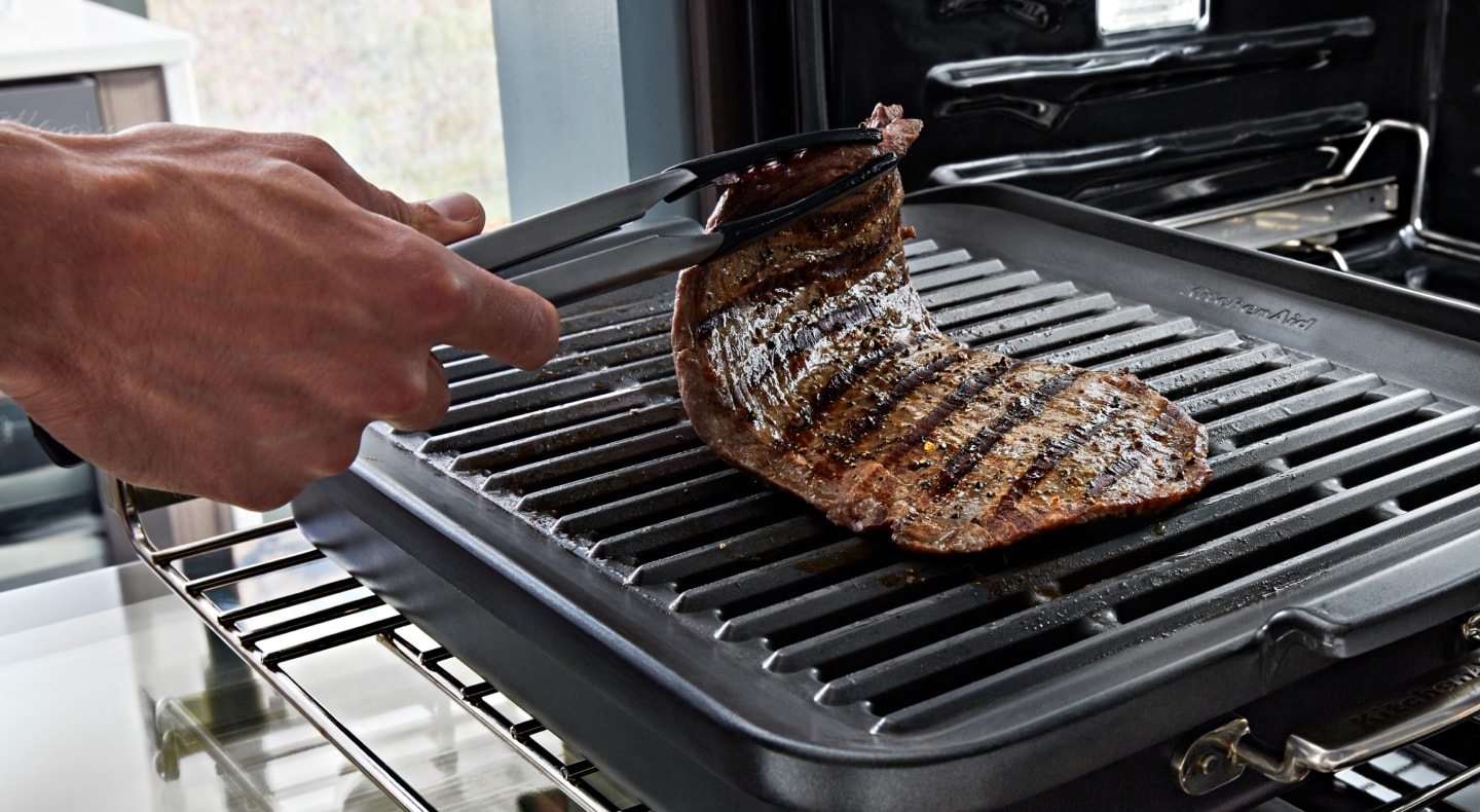 Cooked meat in countertop oven Cooked meat in countertop oven