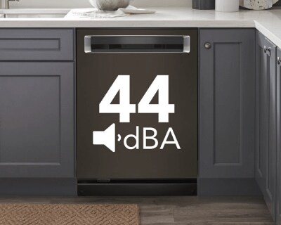 A built-in top control dishwasher with a pocket handle and a label that says 44 dBA on the door