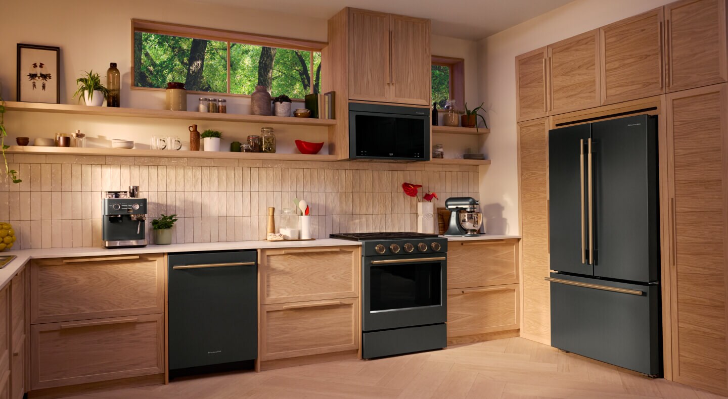 A modern kitchen featuring a KitchenAid® suite of appliances
