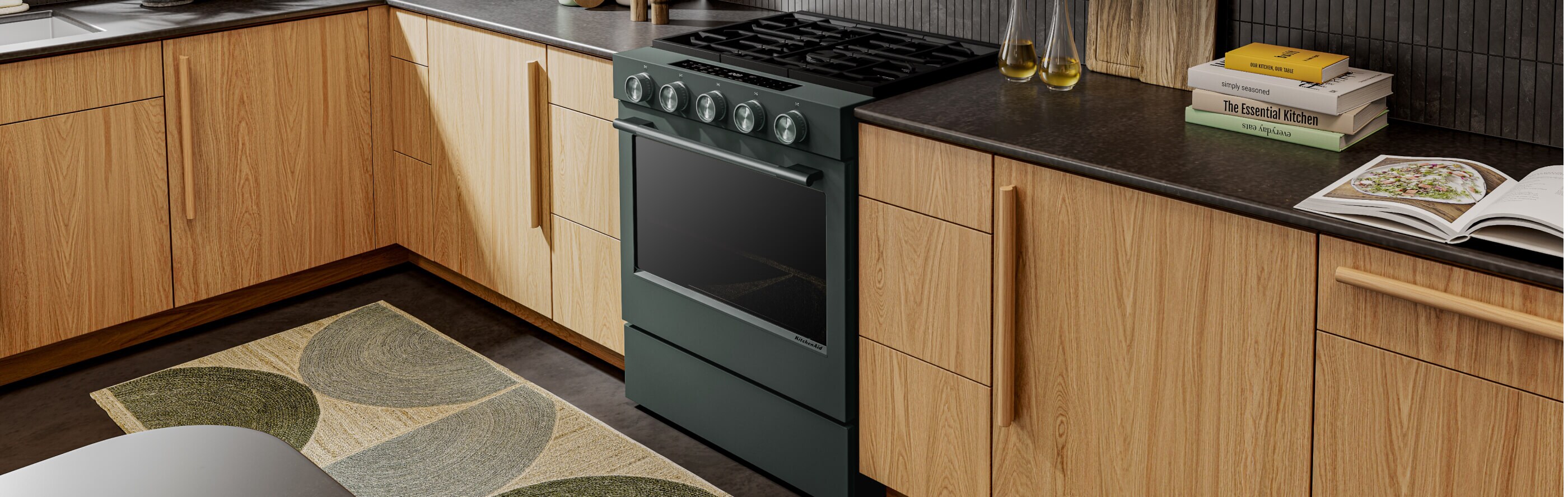 a KitchenAid® gas range set in modern cabinetry