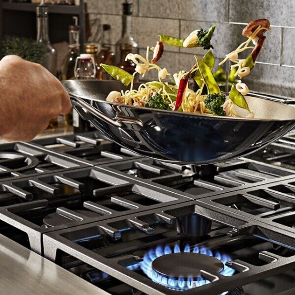 Vegetables being stir fried in a wok