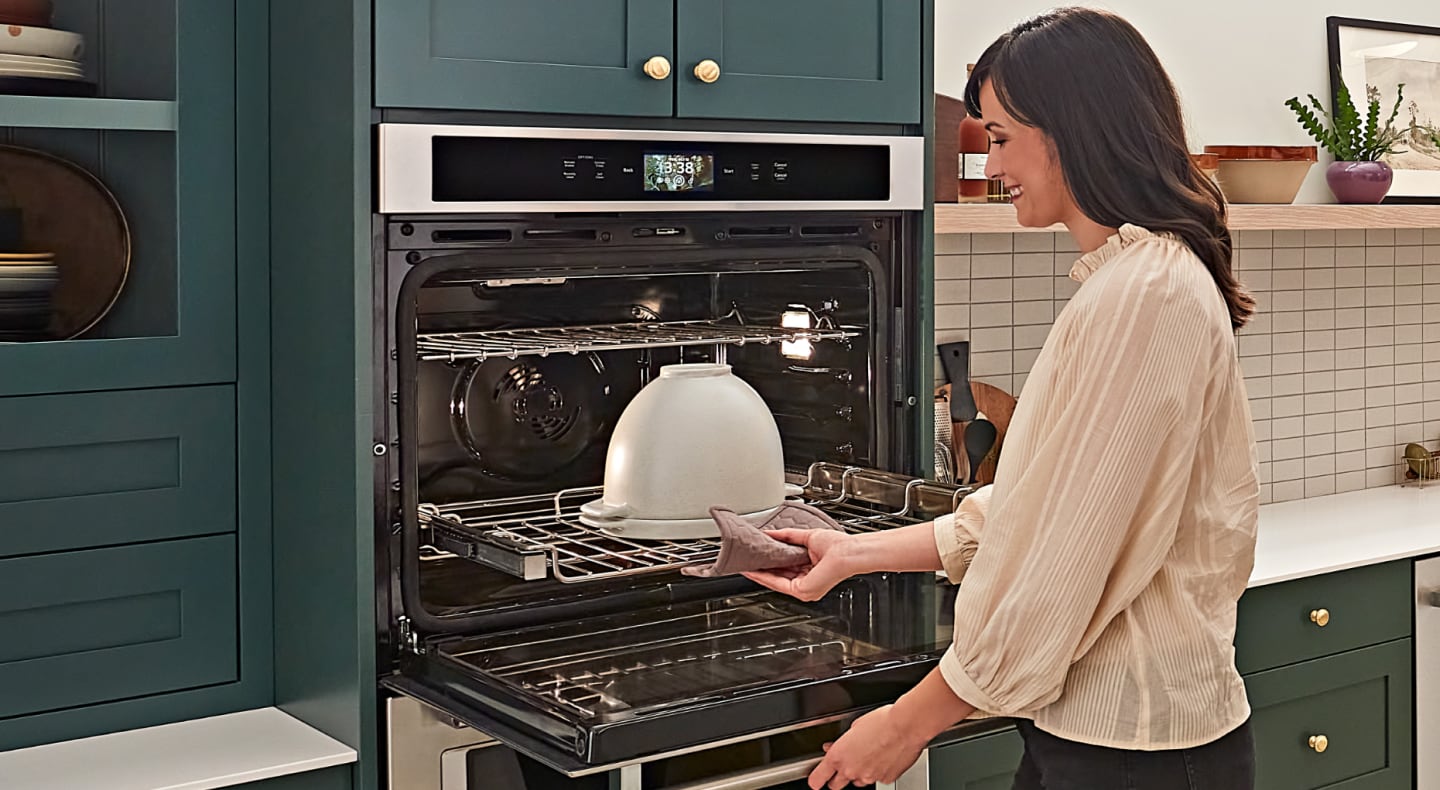 Pulling out a rack from the oven Pulling out a rack from the oven