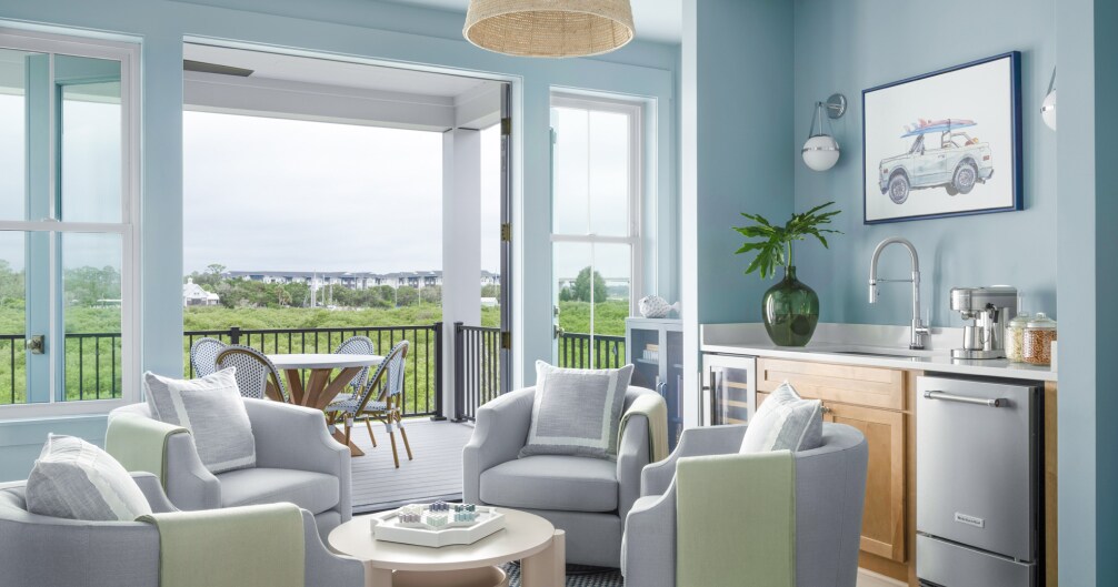 Light and airy living room with doors leading to a balcony