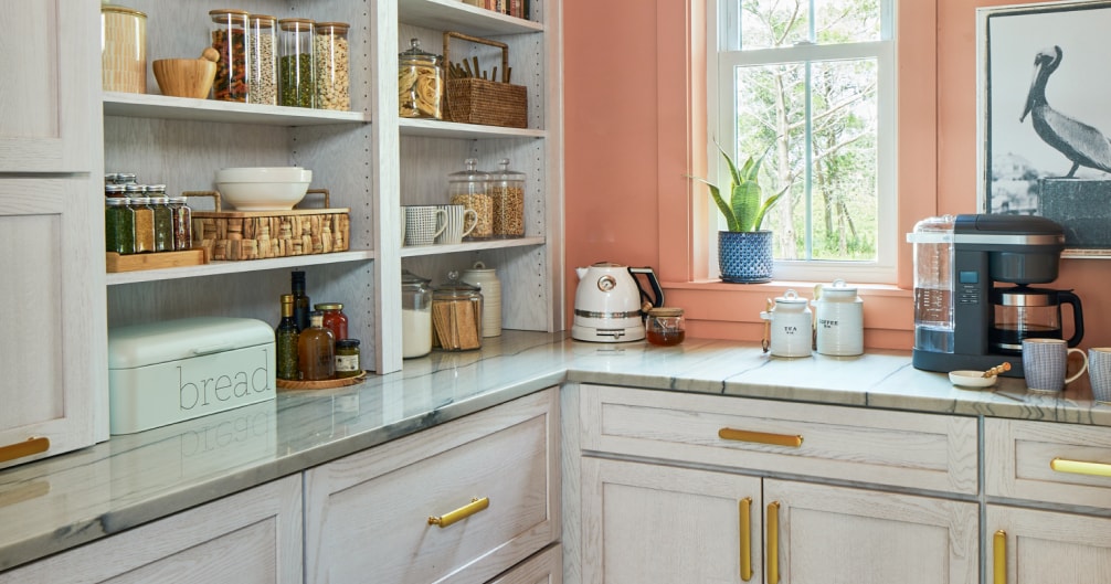 Peach and white kitchen with gold accents