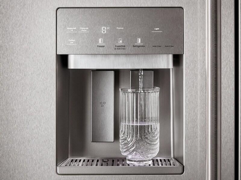 Water filling a glass from a dispenser automatically