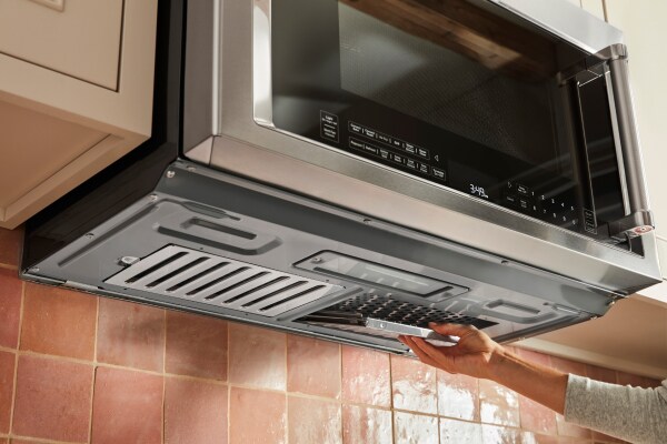 Person installing microwave