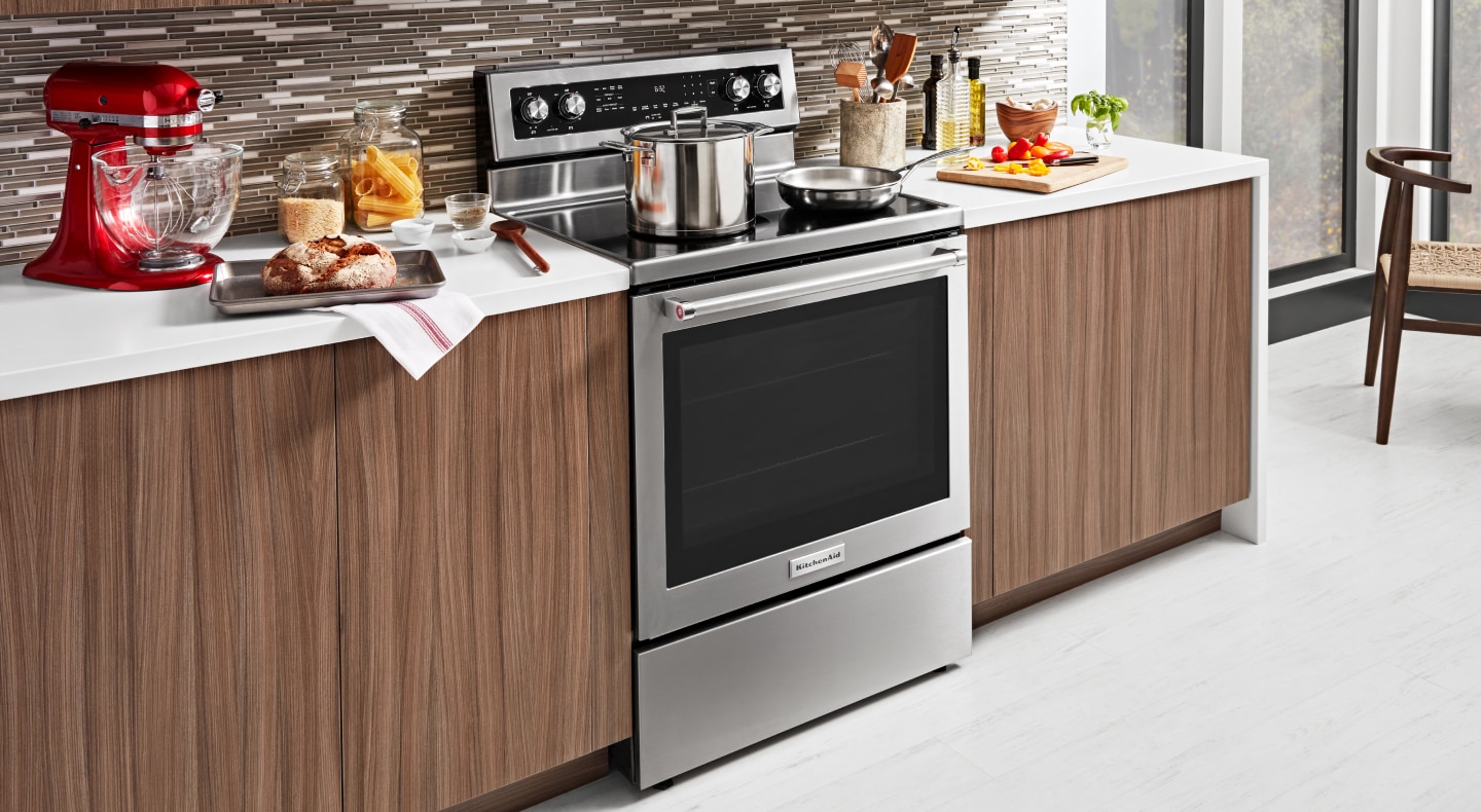 KitchenAid® electric range with a pot and skillet on top KitchenAid® electric range with a pot and skillet on top