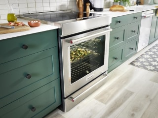 Electric range in a green kitchen