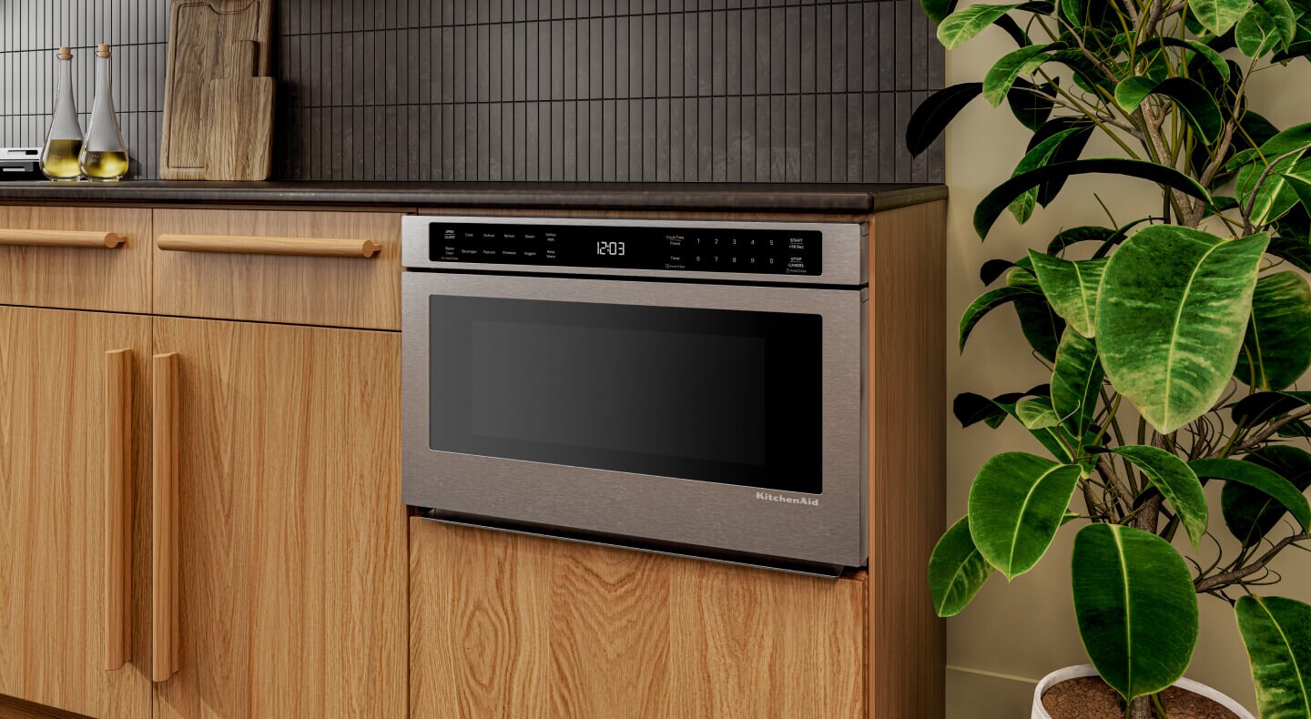 A KitchenAid® Drawer Microwave, surrounded by cabinetry