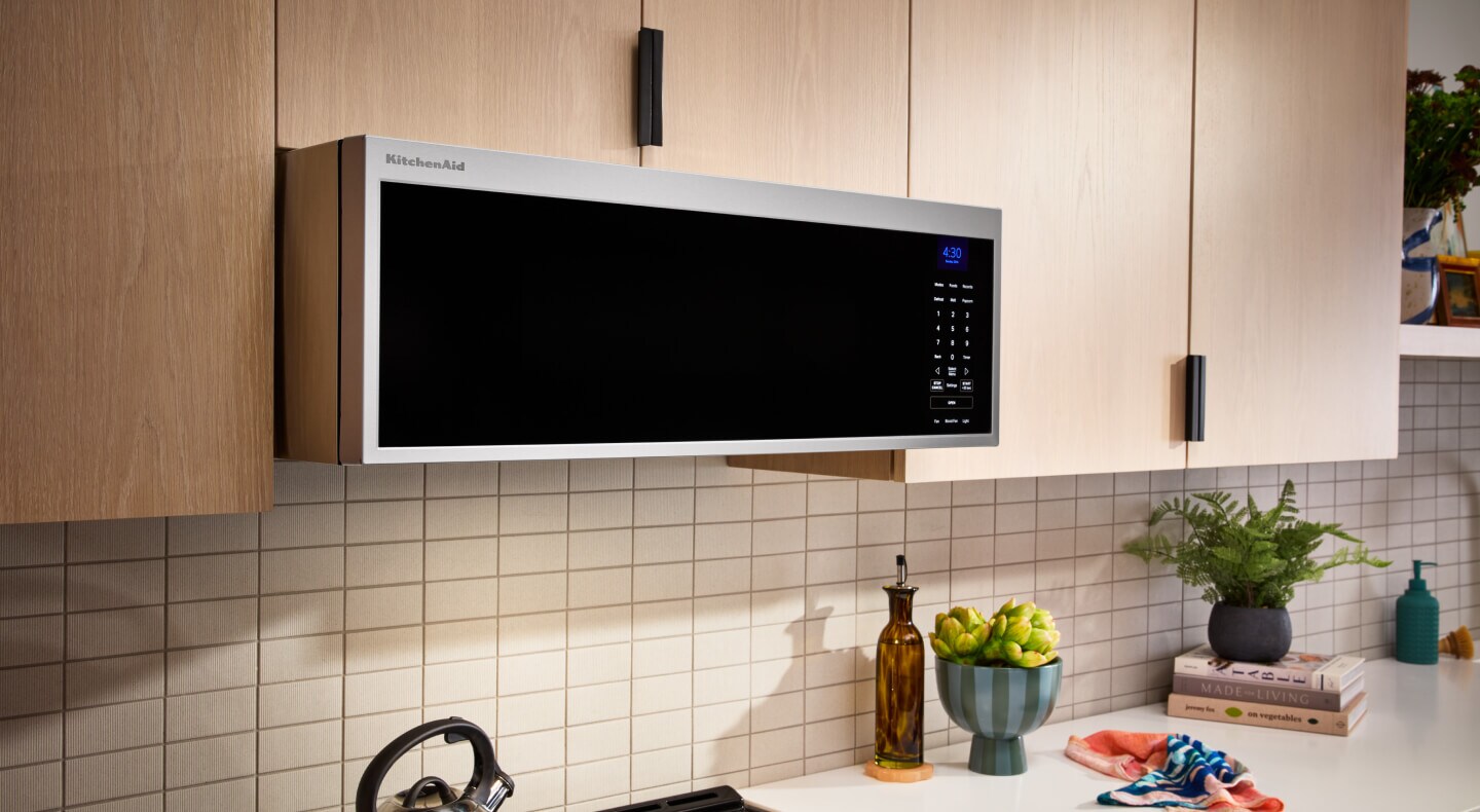 A KitchenAid® Low Profile Microwave above a range