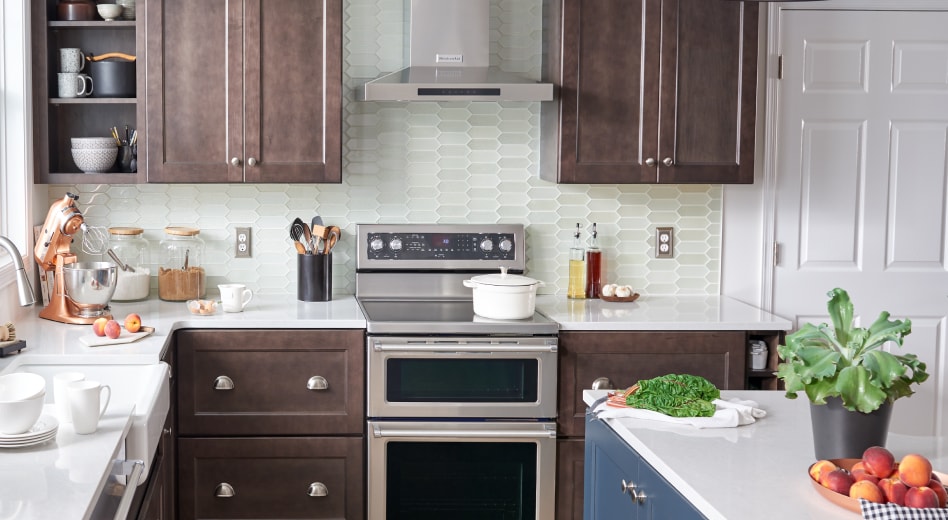 KitchenAid® range hood and double oven in a bright kitchen KitchenAid® range hood and double oven in a bright kitchen