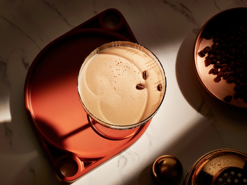 Espresso martini garnished with three coffee beans