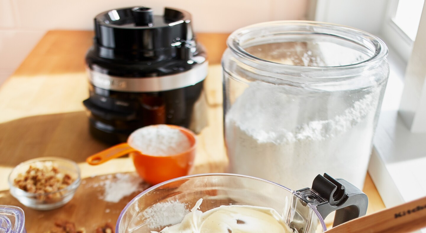 Cake ingredients on countertop with KitchenAid® food processor Cake ingredients on countertop with KitchenAid® food processor