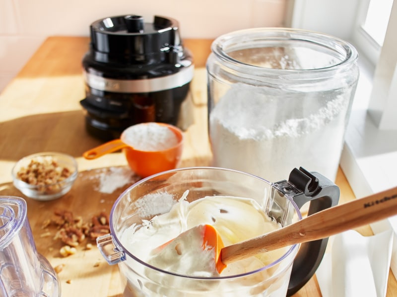 Cake ingredients on countertop with KitchenAid® food processor Cake ingredients on countertop with KitchenAid® food processor