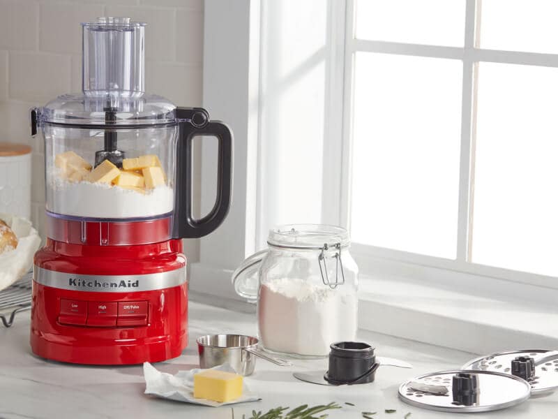 KitchenAid® food processor with bread ingredients on countertop