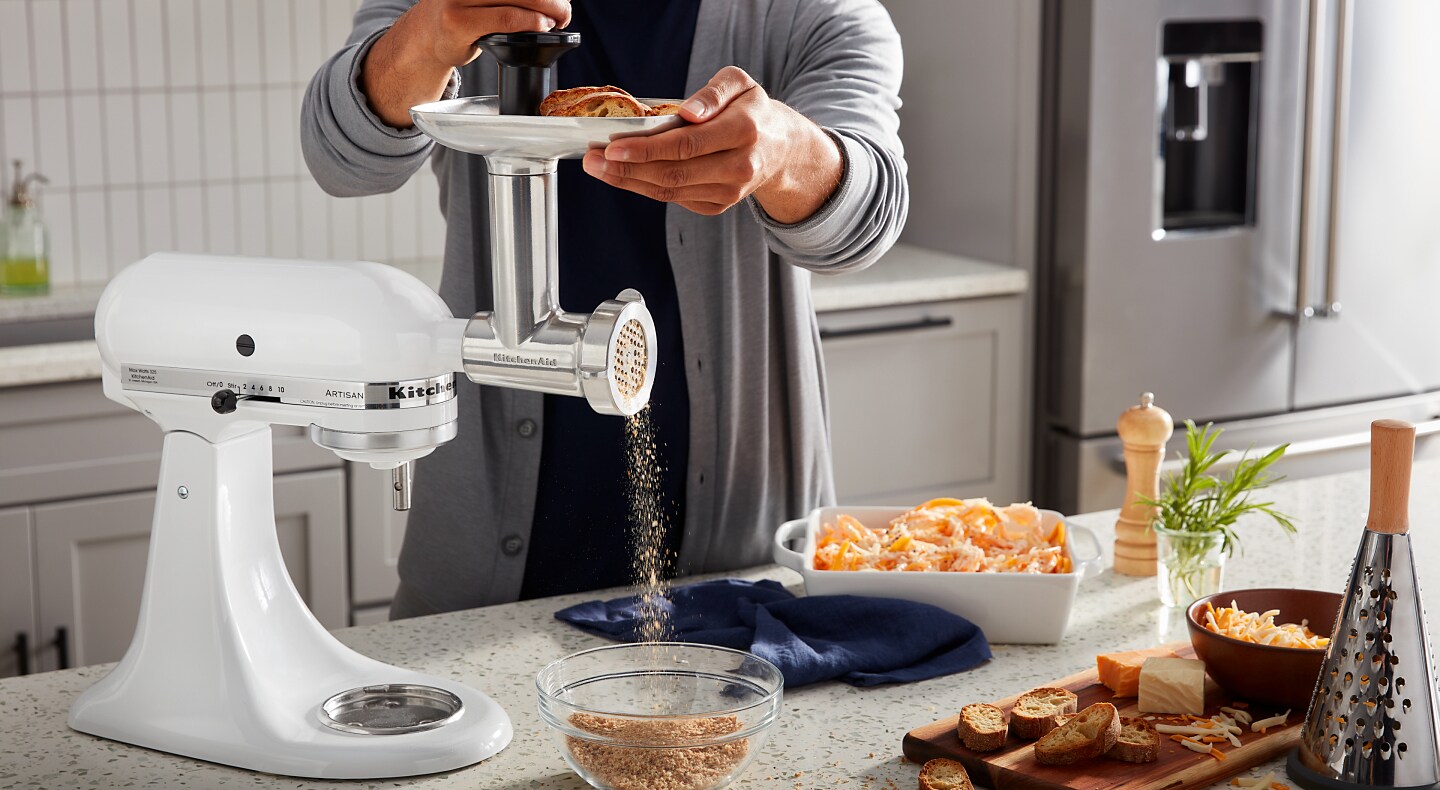 Person using KitchenAid® stand mixer to grind bread Person using KitchenAid® stand mixer to grind bread