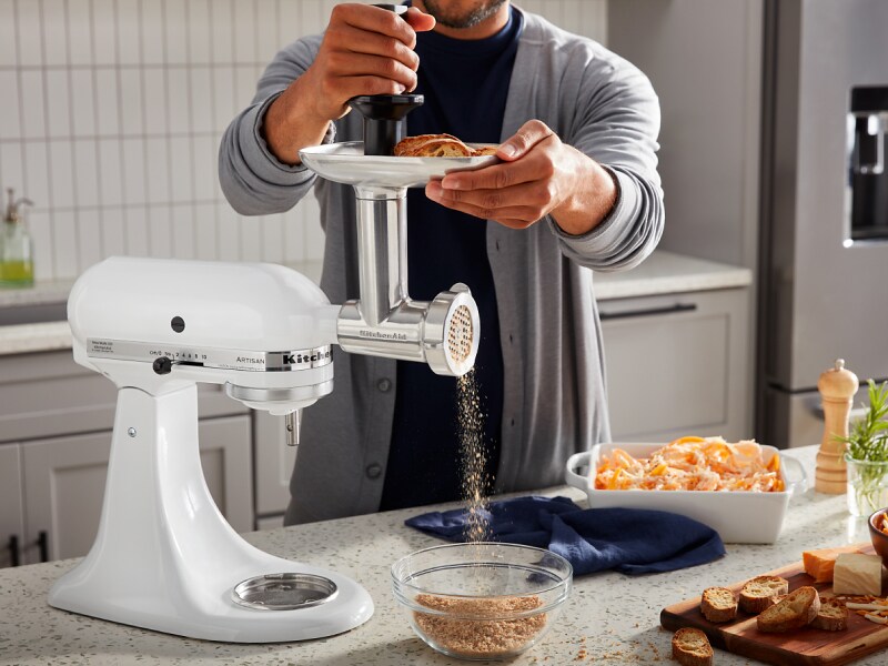 Person using KitchenAid® stand mixer to grind bread Person using KitchenAid® stand mixer to grind bread