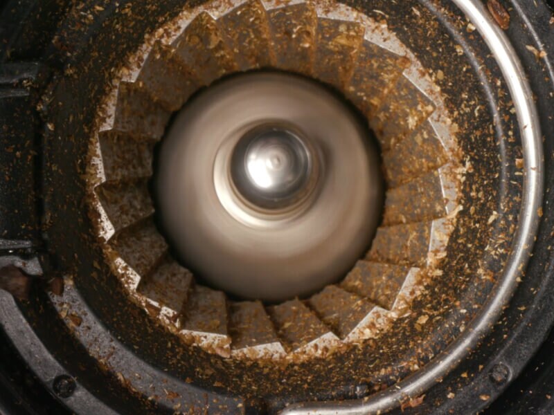 Closeup image of a coffee bean grinder