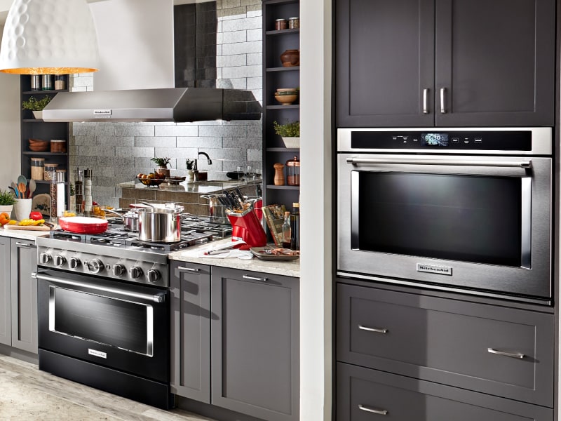 Kitchen with gray cabinetry, gas range and single wall oven