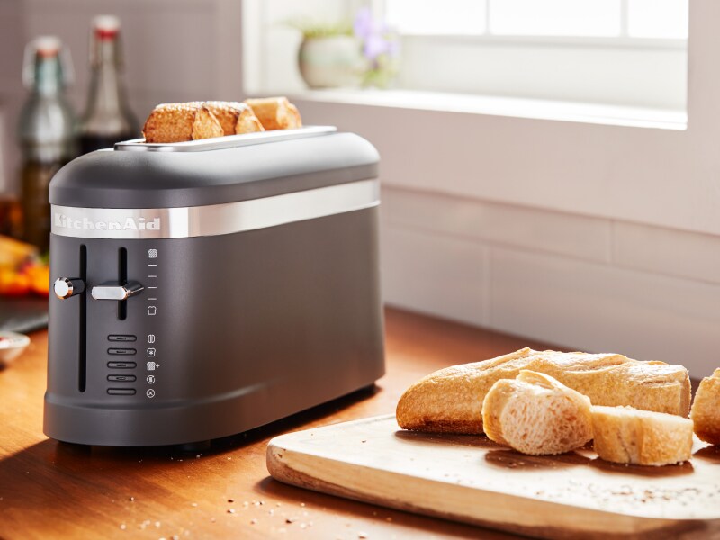 Bread being toasted in a KitchenAid® toaster.