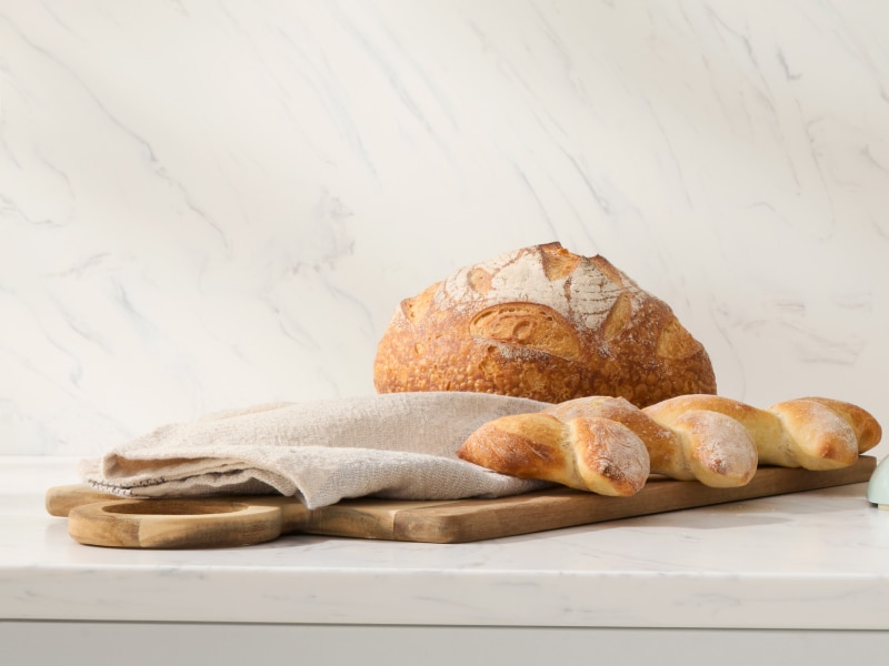Assorted bread sitting on a countertop.