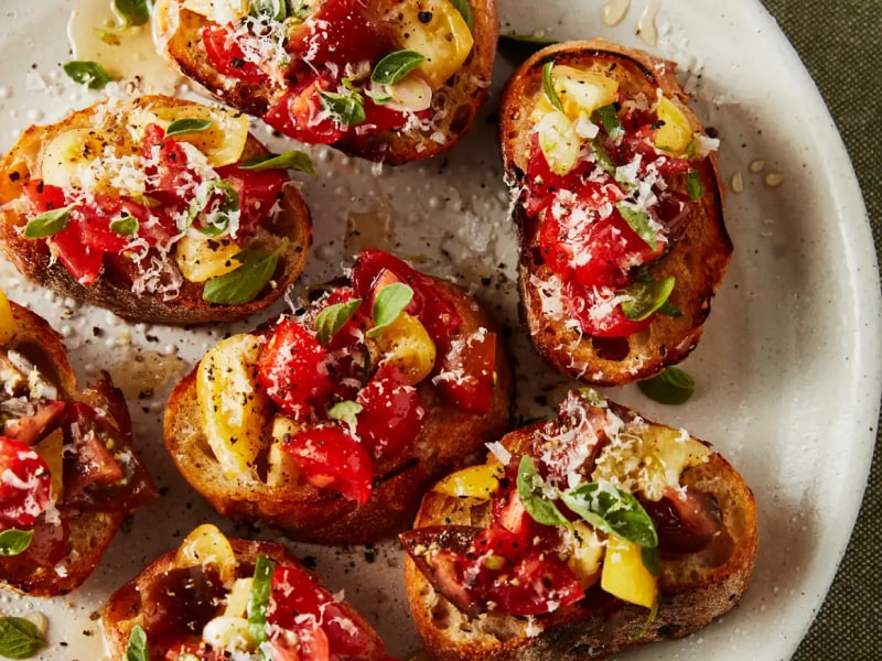 Fresh bruschetta garnished with basil. Fresh bruschetta garnished with basil.