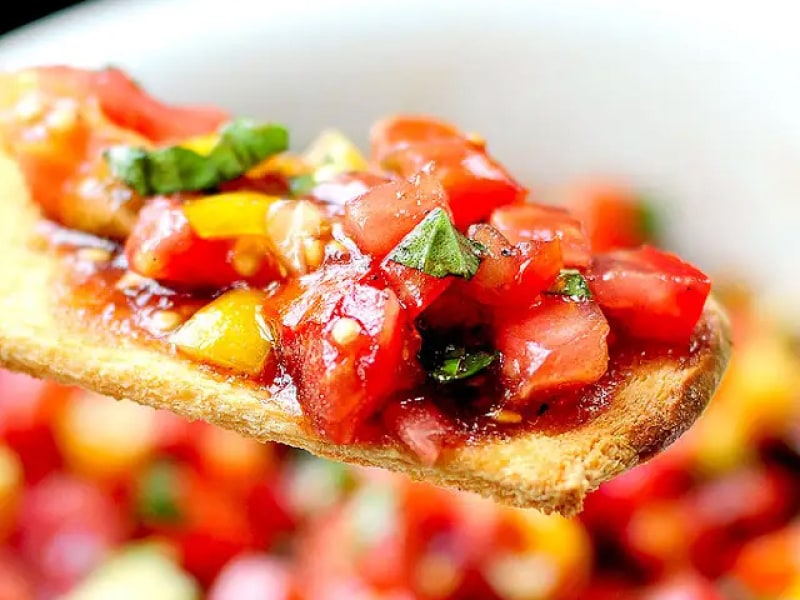 Bruschetta on a thin piece of bread. Bruschetta on a thin piece of bread.