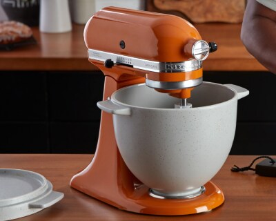 Orange KitchenAid® stand mixer with gray mixing bowl