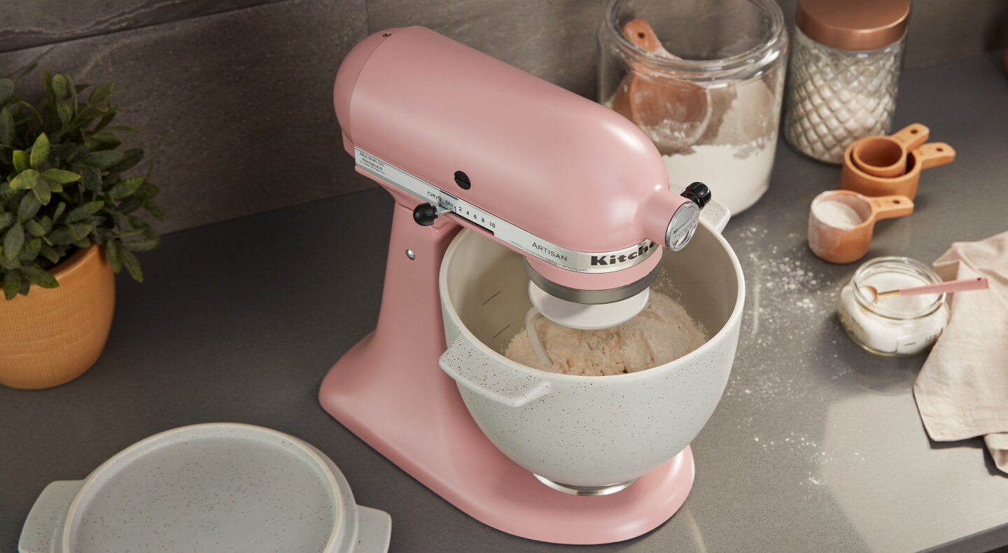Pink KitchenAid® stand mixer with rice dough in stainless steel bowl Pink KitchenAid® stand mixer with rice dough in stainless steel bowl