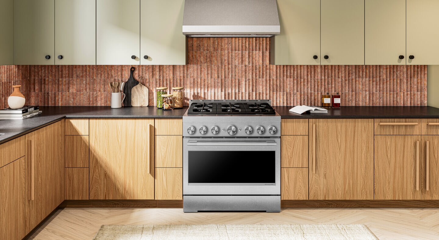 Interior of a kitchen with wood cabinetry and a gas range