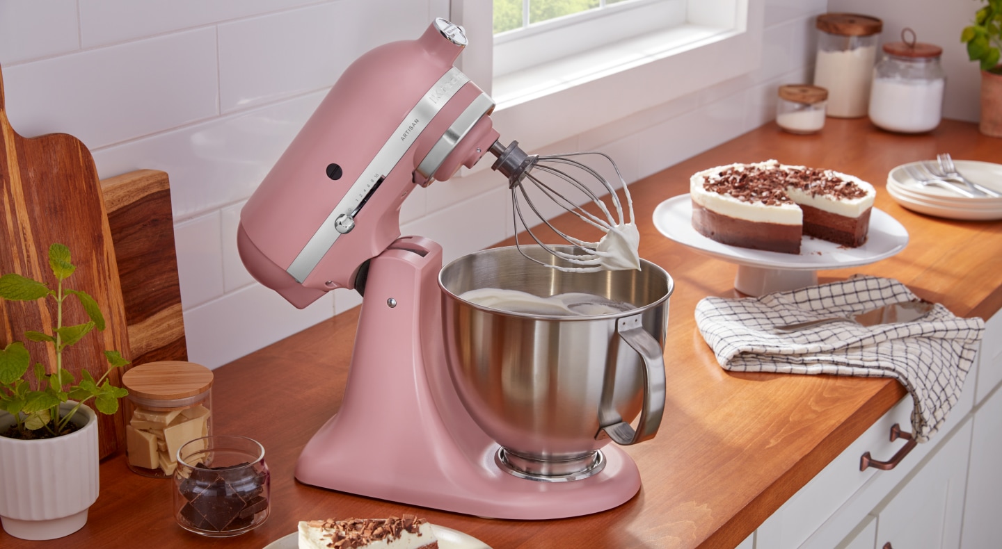 Homemade whipped cream in a pink KitchenAid® stand mixer Homemade whipped cream in a pink KitchenAid® stand mixer