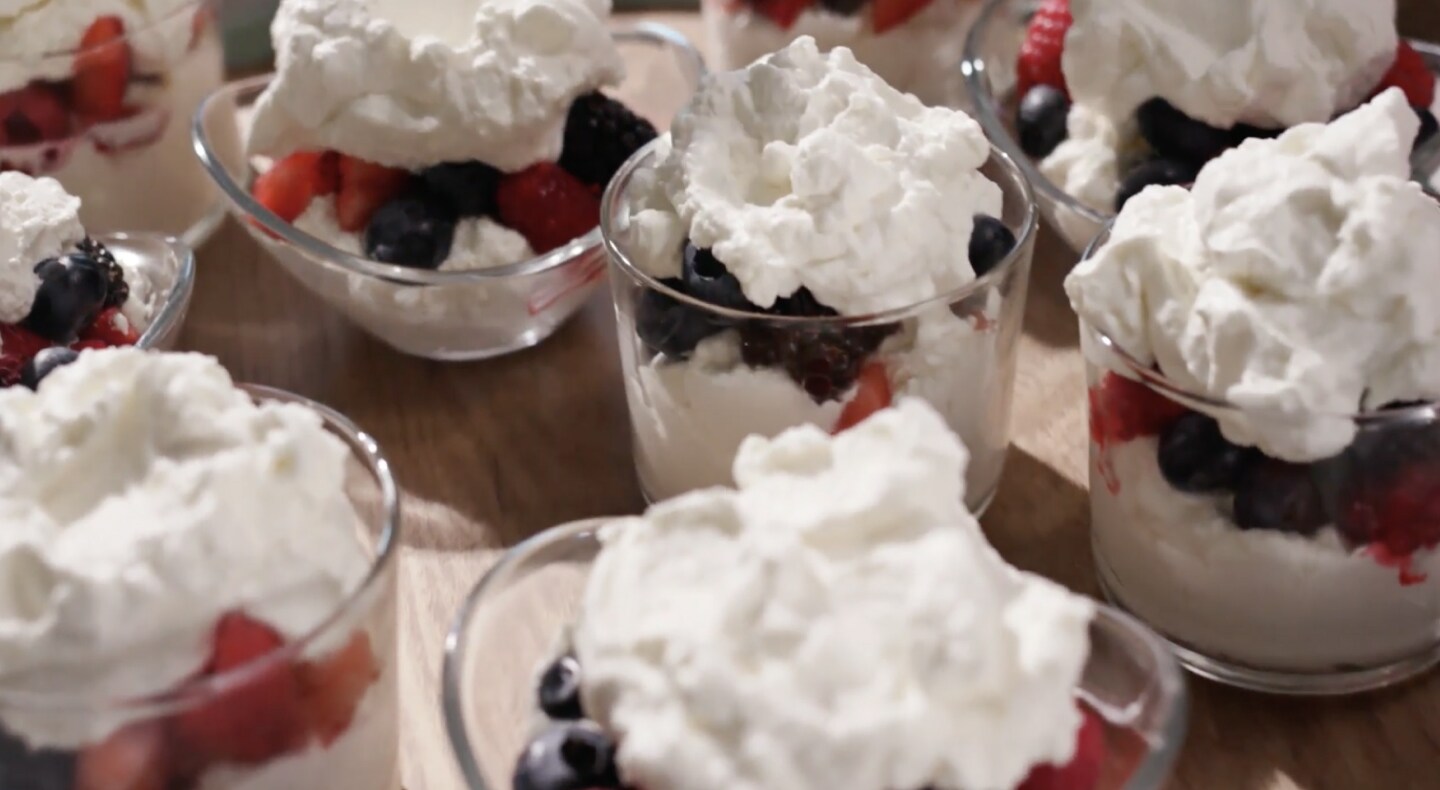 Fruit parfait topped with whipped cream Fruit parfait topped with whipped cream