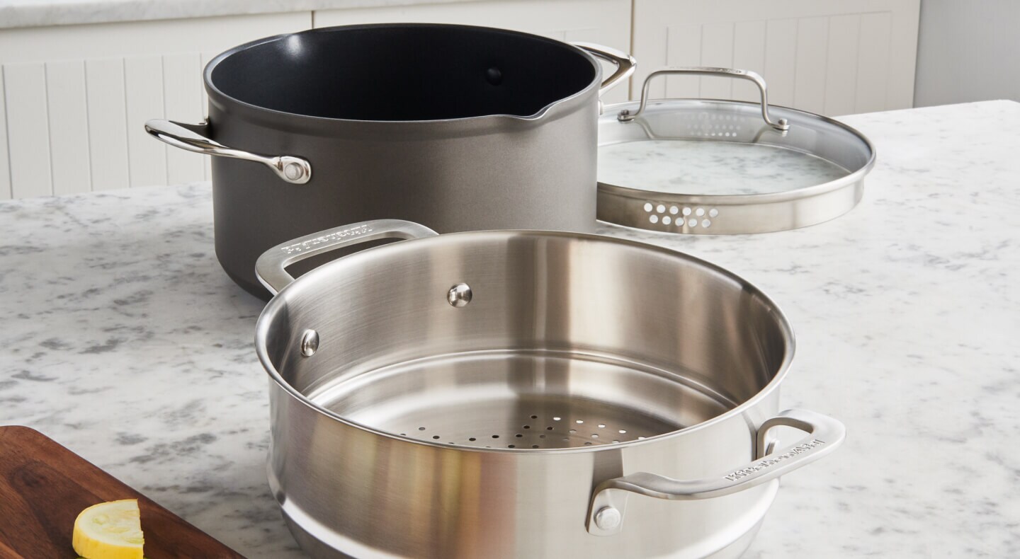 A pot with a metal steaming basket