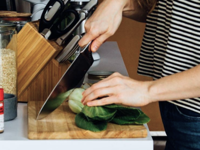 Person cutting vegetable