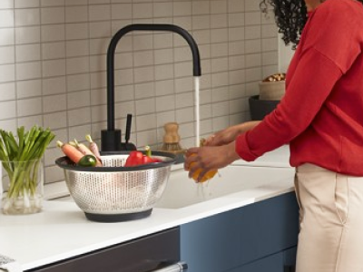 Person washing vegetable