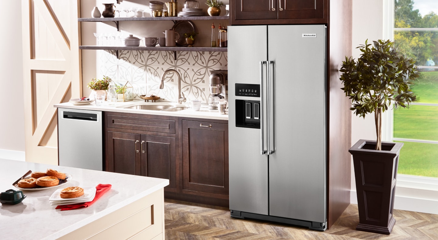 A stainless steel KitchenAid® French Door Refrigerator in a rustic kitchen A stainless steel KitchenAid® French Door Refrigerator in a rustic kitchen