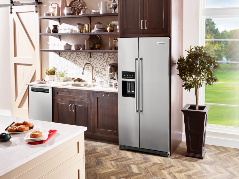 A stainless steel KitchenAid® French Door Refrigerator in a rustic kitchen A stainless steel KitchenAid® French Door Refrigerator in a rustic kitchen