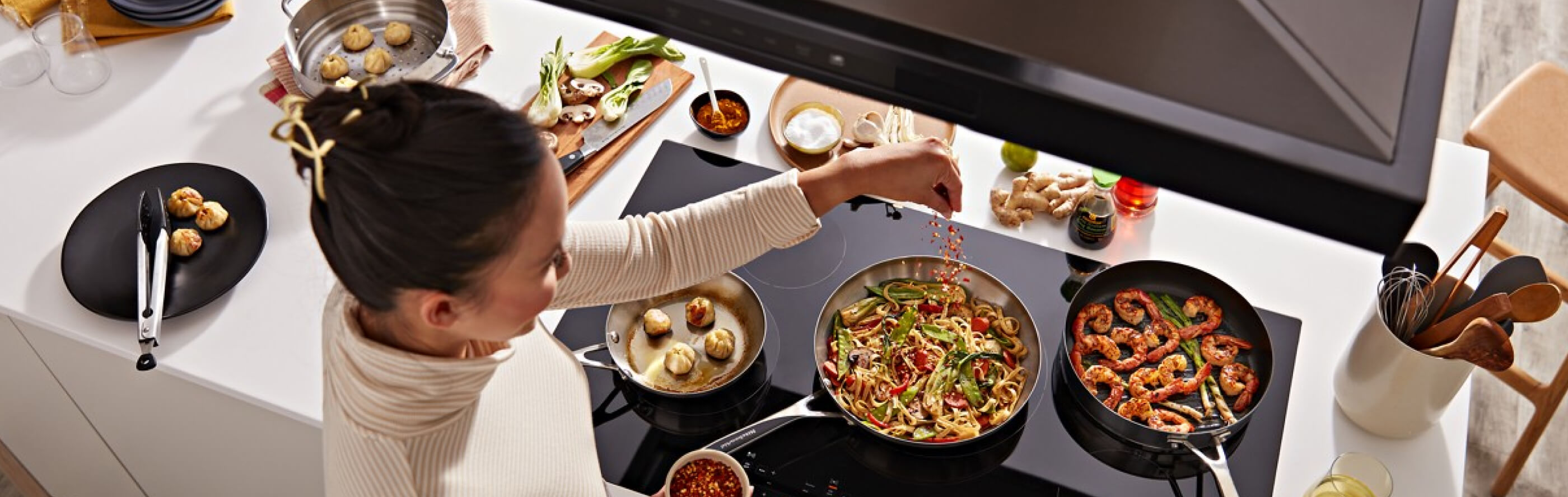 Person cooking on an electric cooktop