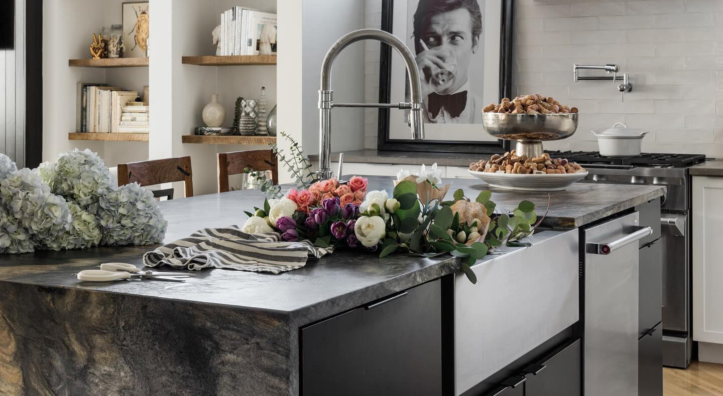 A kitchen island with a sink and dishwasher installed in it A kitchen island with a sink and dishwasher installed in it
