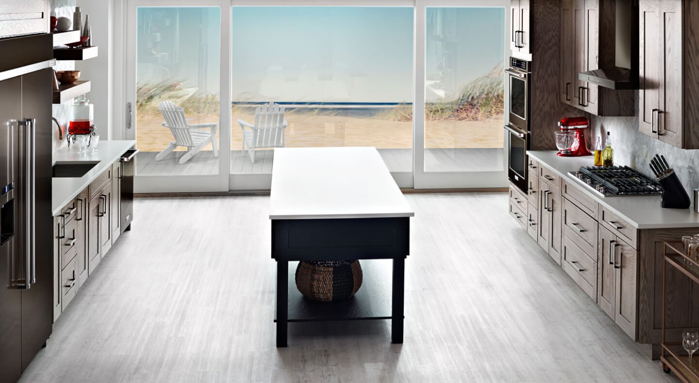 A large galley-shaped kitchen with an island A large galley-shaped kitchen with an island