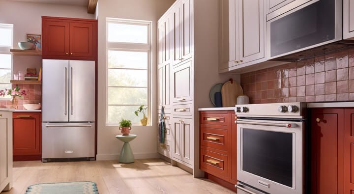 A brightly lit kitchen with stainless steel KitchenAid® appliances