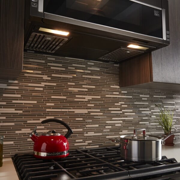 The underside of a low profile microwave with soft lighting