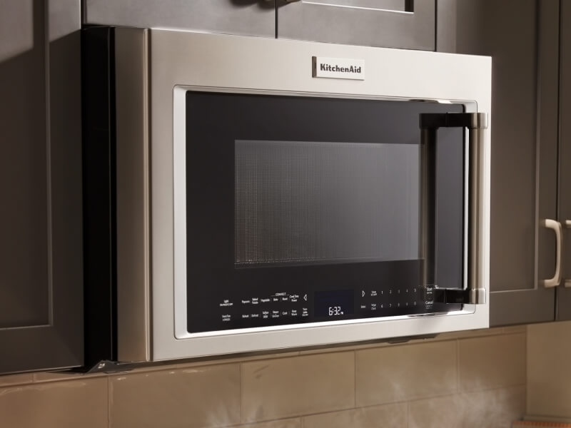 KitchenAid® over-the-range microwave in brown cabinetry KitchenAid® over-the-range microwave in brown cabinetry